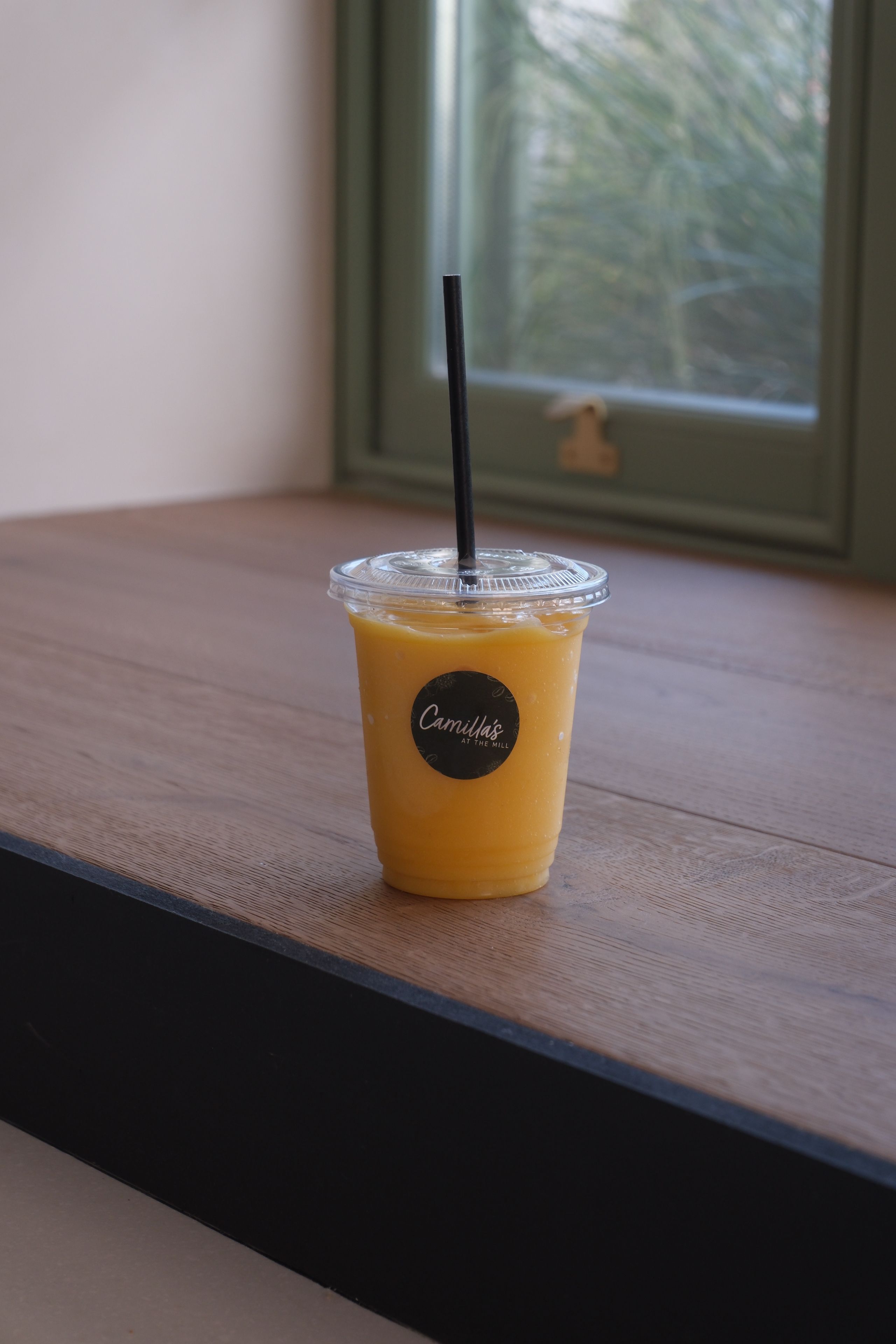 A mango smoothie in a glass