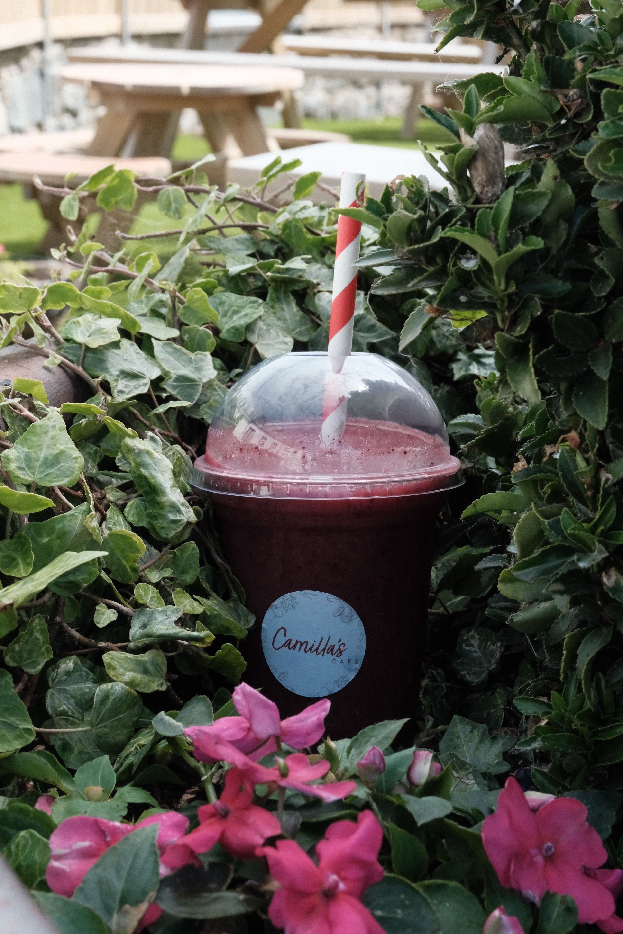A purple berry smoothie in a glass