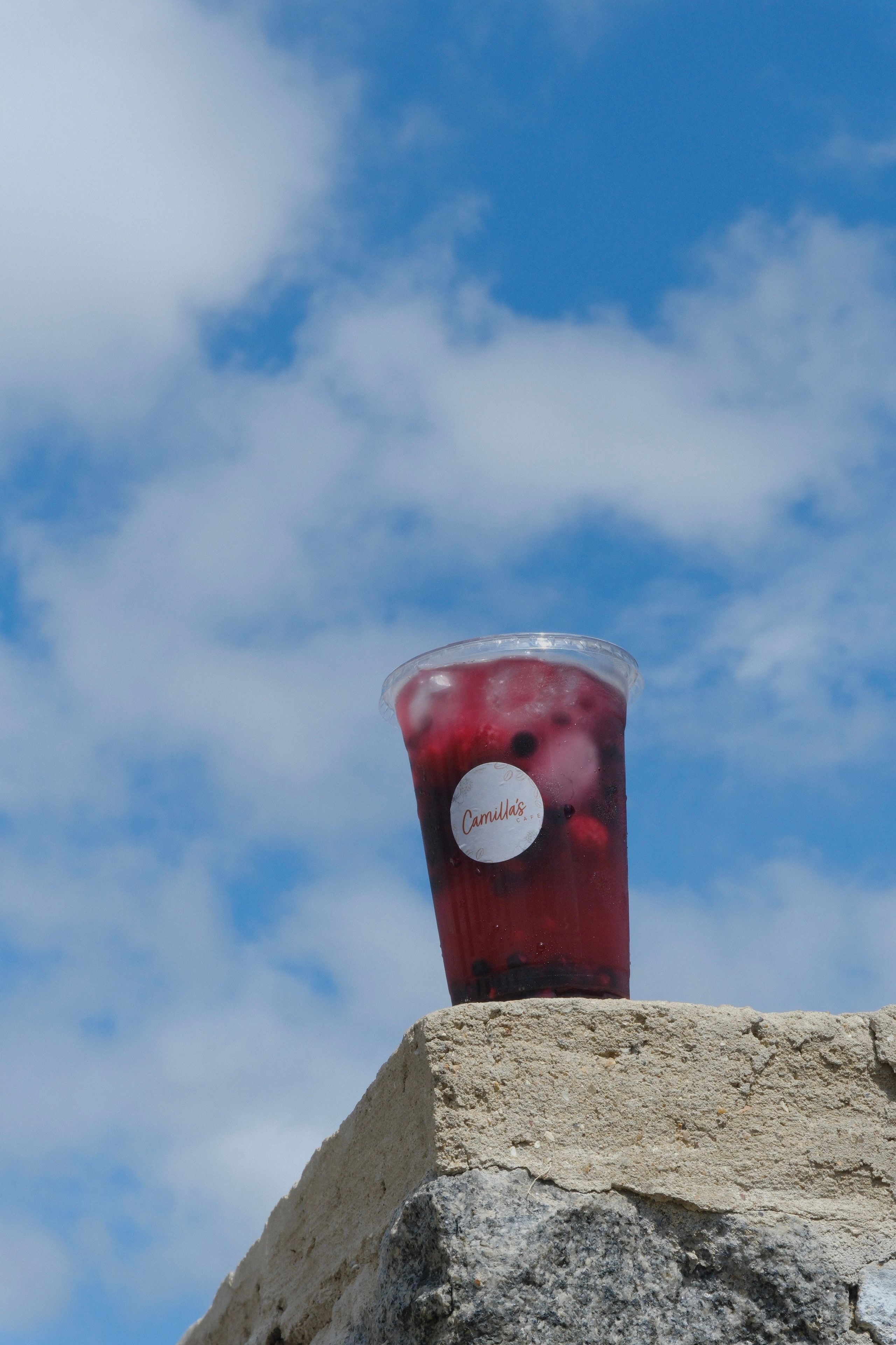 A berry refresher drink over ice