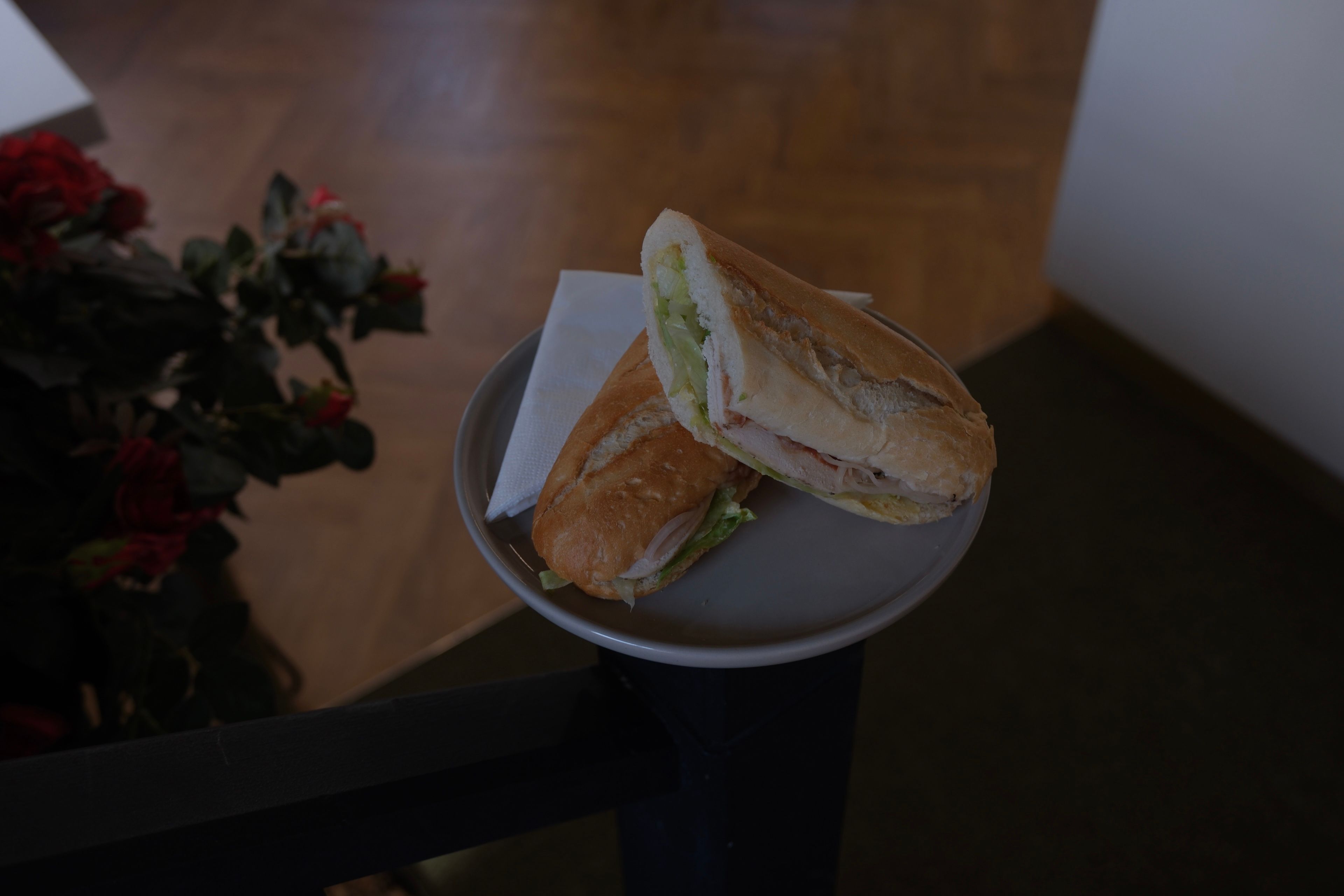A grilled chicken sandwich with lettuce and tomato
