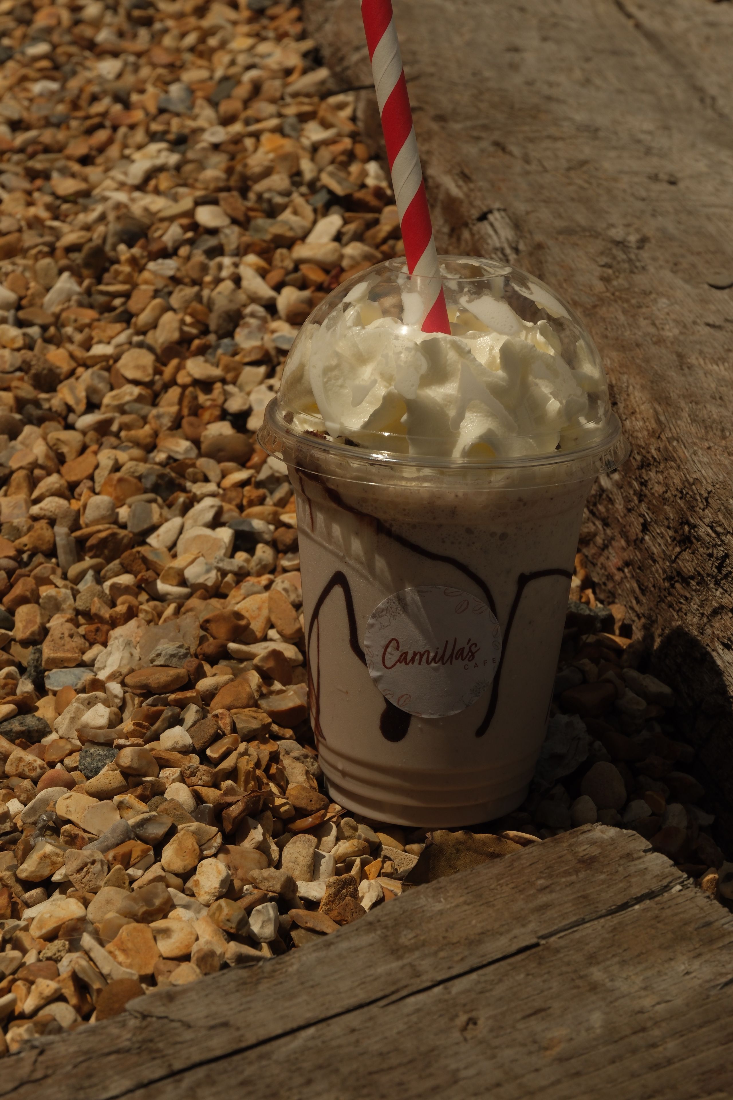 A cookies and cream milkshake topped with cream