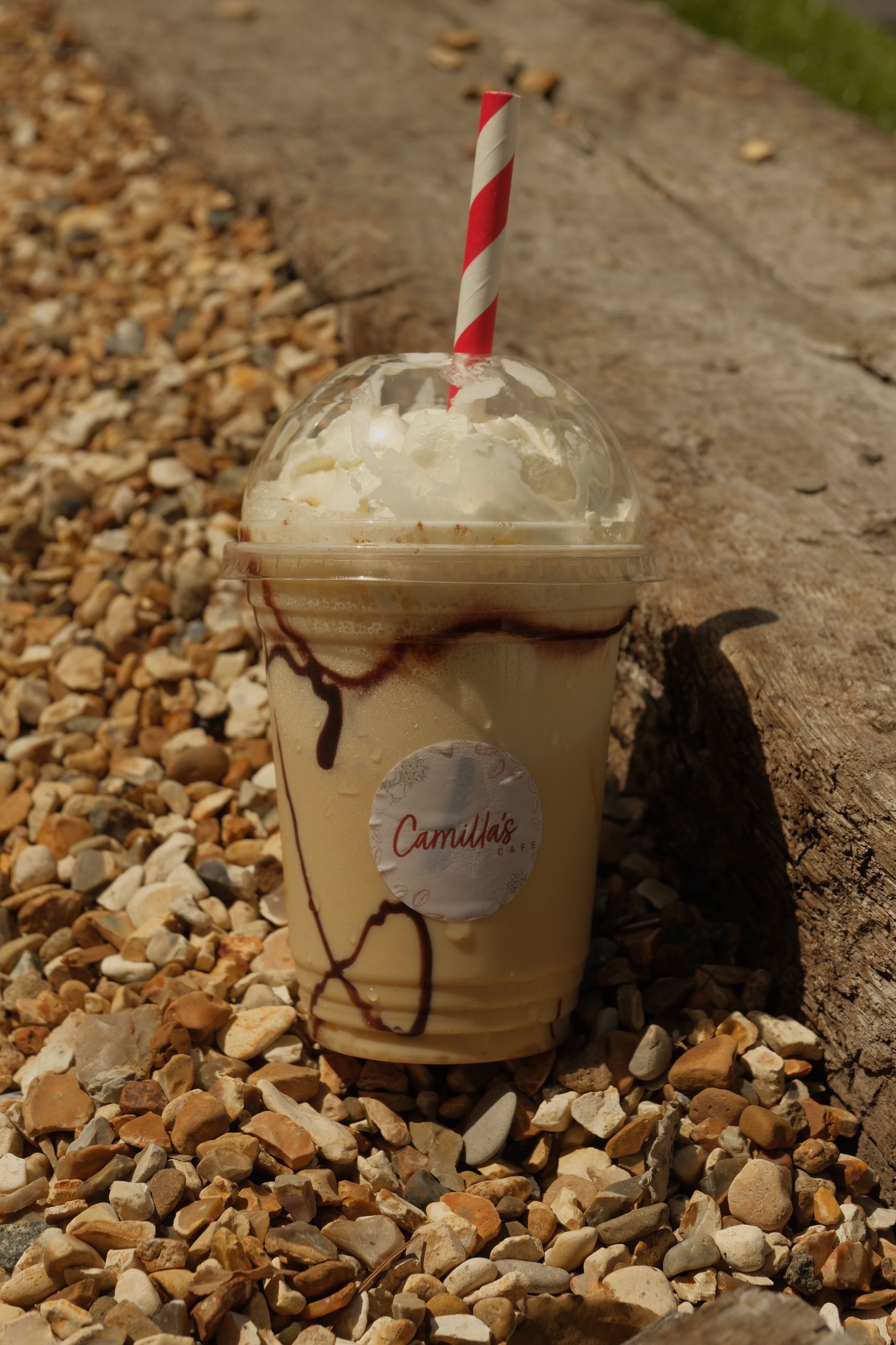 A banana fudge milkshake topped with cream