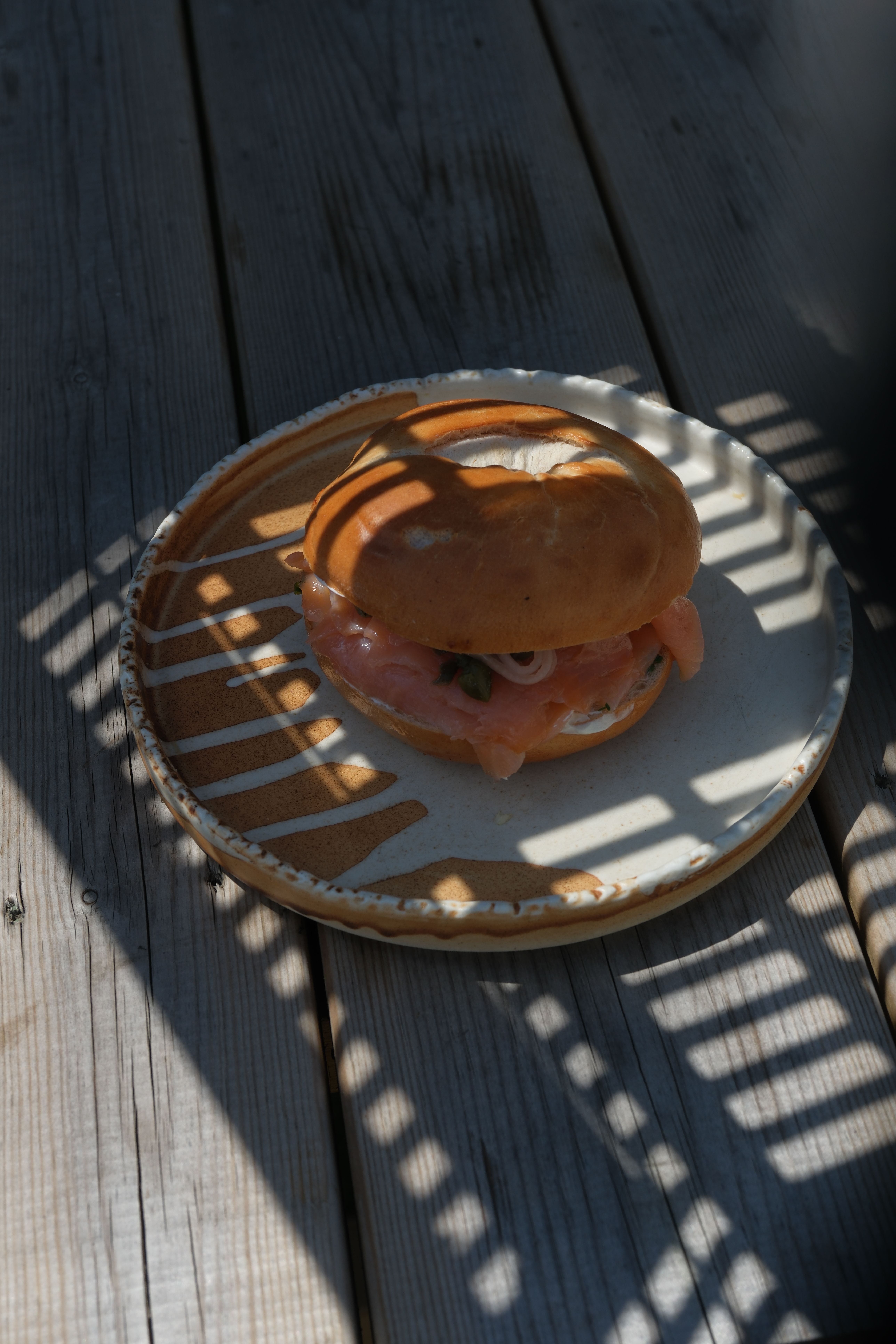 A smoked salmon sandwich with rocket