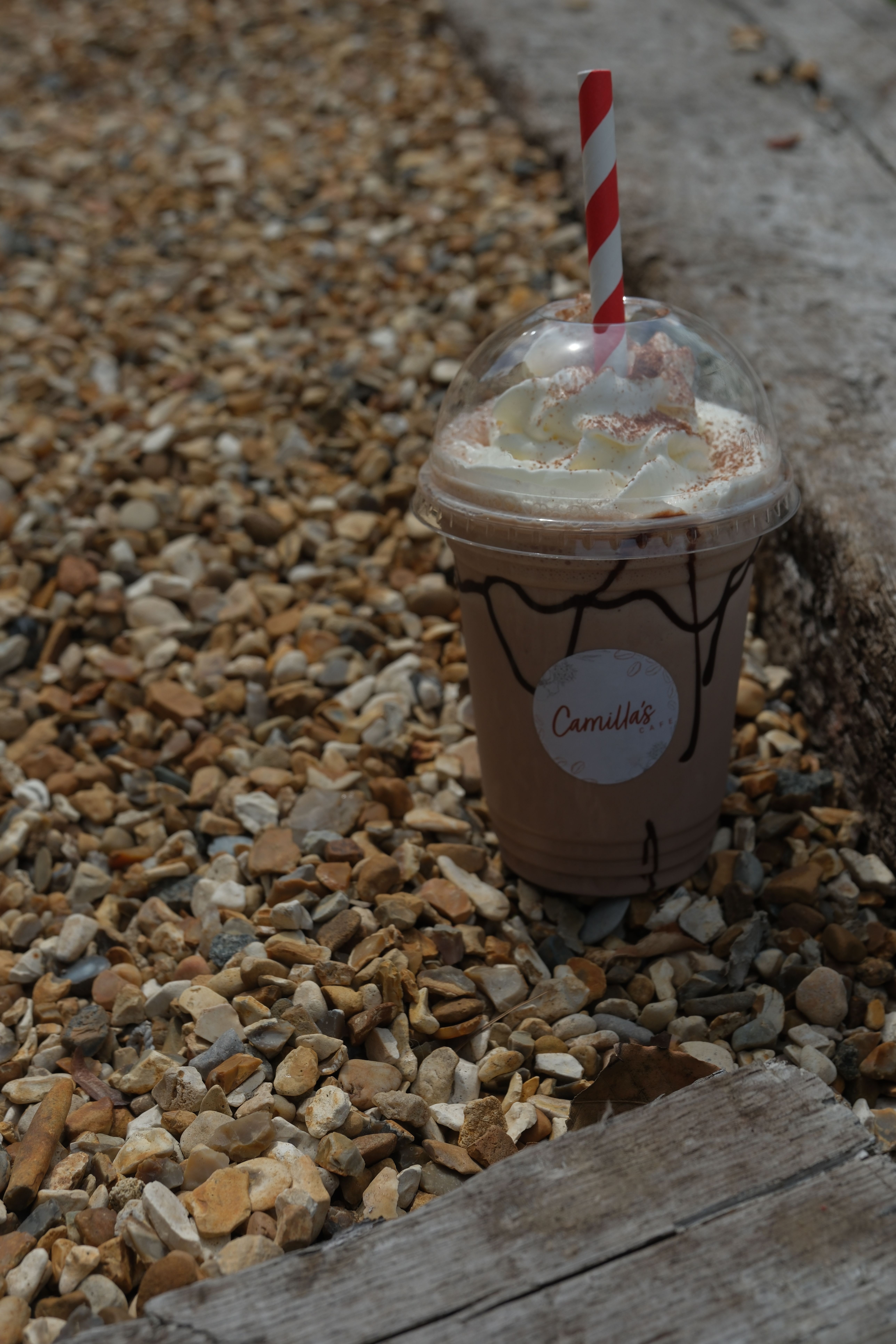 A double chocolate milkshake topped with cream
