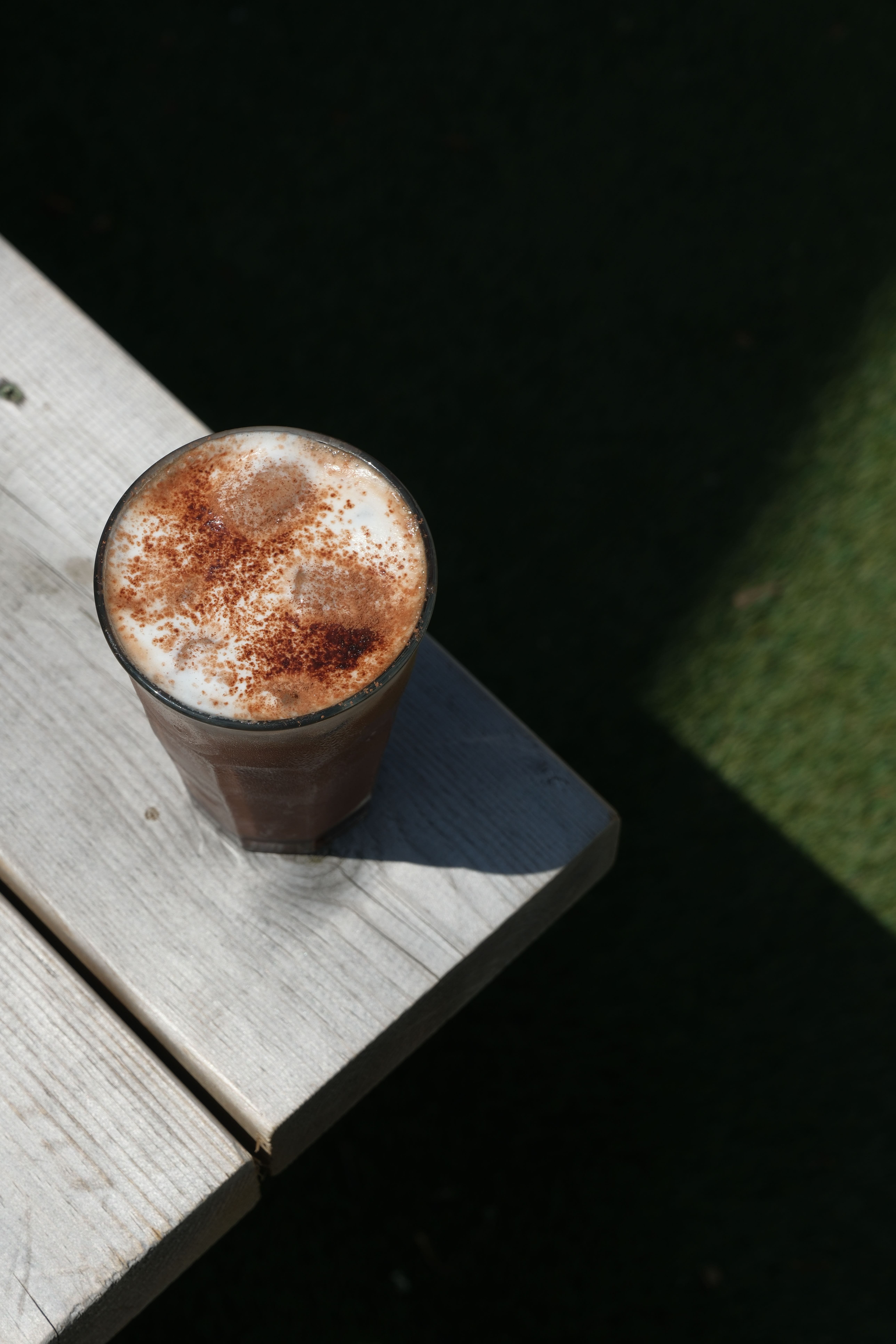 An iced mocha in a tall glass with ice