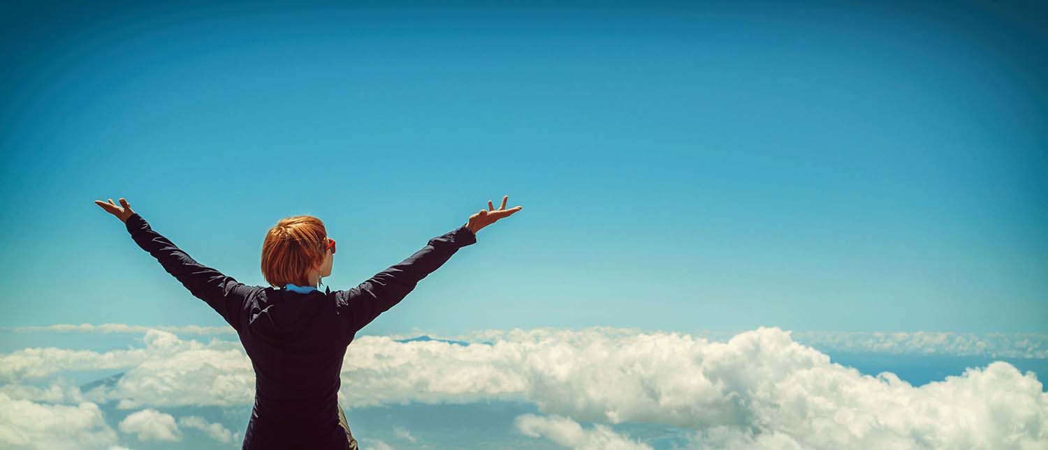 Image of woman looking at clouds