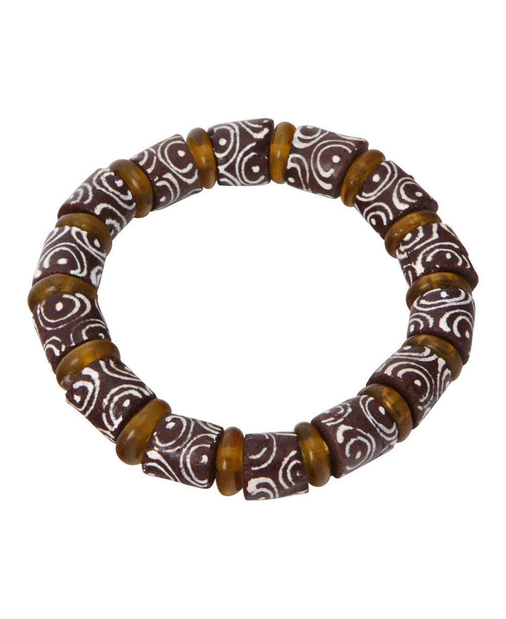 Add a touch of authentic African culture to your look with this colorful Krobo bead bracelet. Made from recycled glass using traditional techniques from Ghana’s Krobo artisans, each bead is individually designed with bold patterns and vibrant colors, making every bracelet one-of-a-kind. Perfect for everyday wear or as a statement accessory, it blends sustainability with timeless African artistry. This bracelet can be worn on its own for a simple pop of color or stacked with other pieces for a layered style. Durable and lightweight, it’s a meaningful addition to any jewelry collection and a true celebration of African creativity.