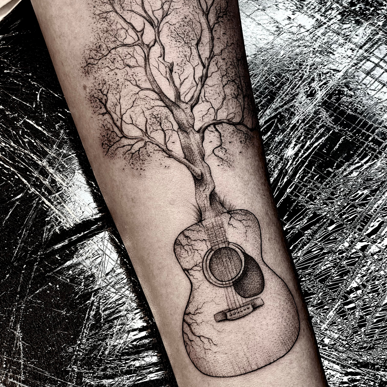 DEATH OF AN ACOUSTIC GUITAR AND VIOLIN PLAYER tattoo idea | TattoosAI