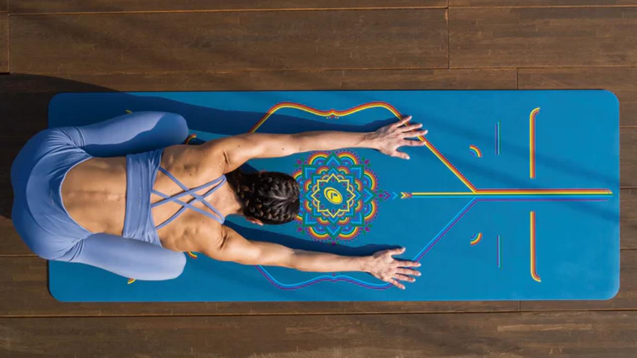 Person stretching on a Liforme Yoga mat
