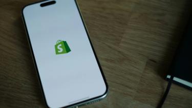 Shopify icon on mobile phone
