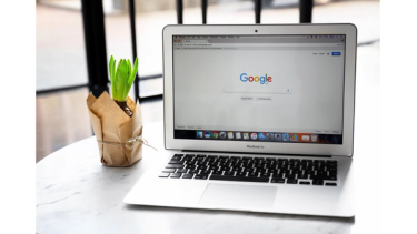 Google search screen laptop in office