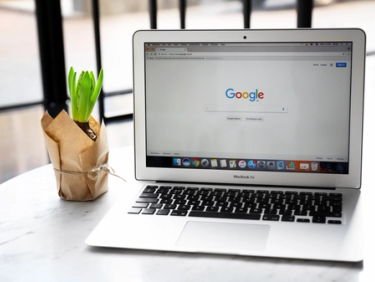 Google search screen laptop in office