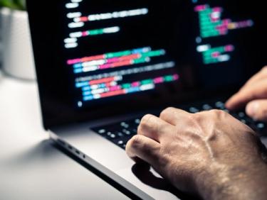 Laptop with coding HTML text