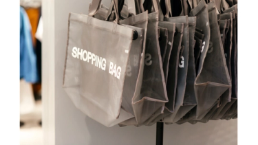 Shopping bags hanging in a retail store