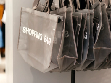 Shopping bags hanging in a retail store