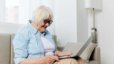 Elderly lady using a laptop