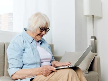 Elderly lady using a laptop
