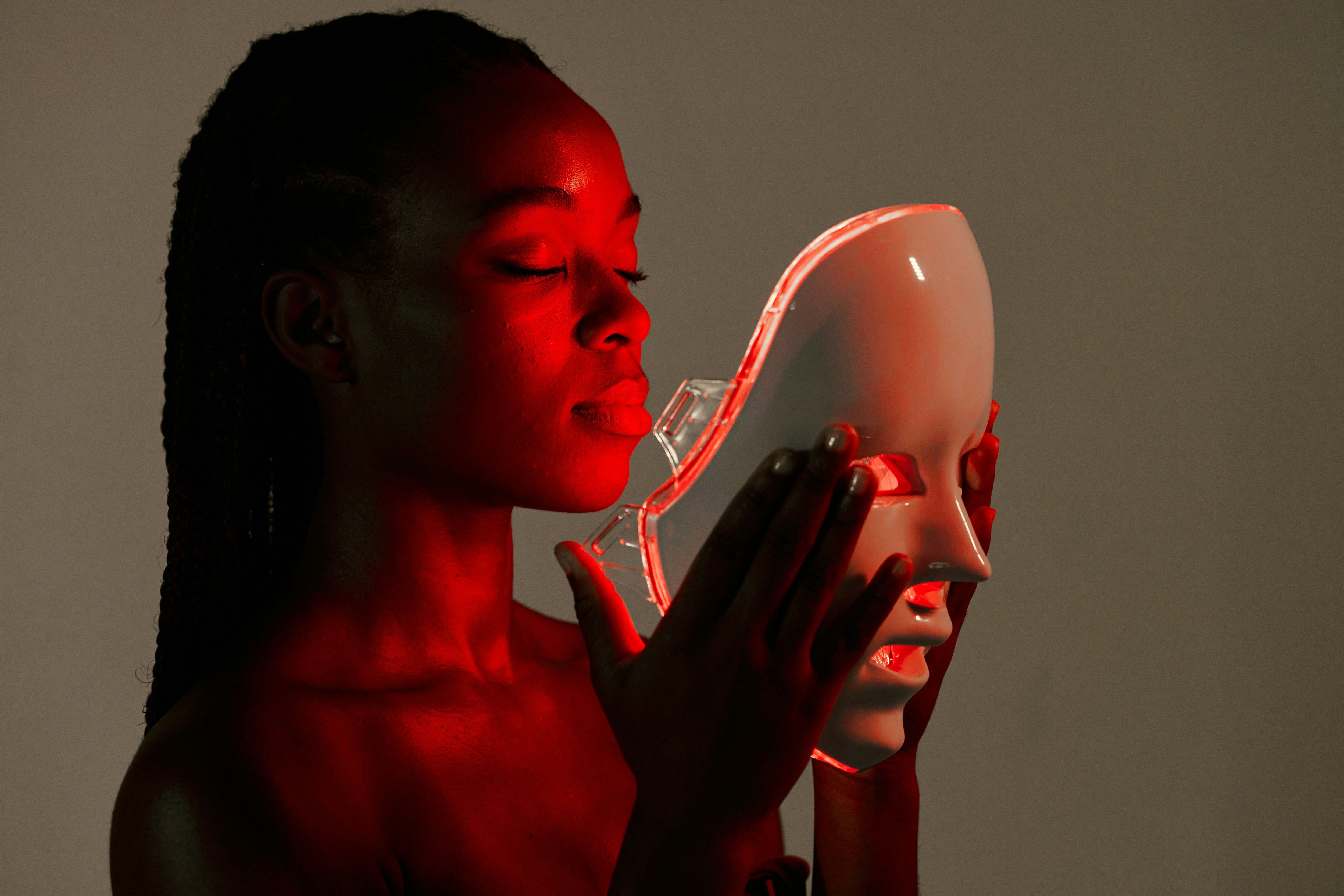 Woman using Red light mask 