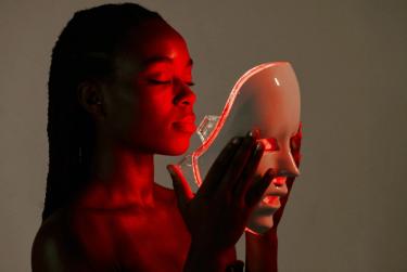 Woman using Red light mask