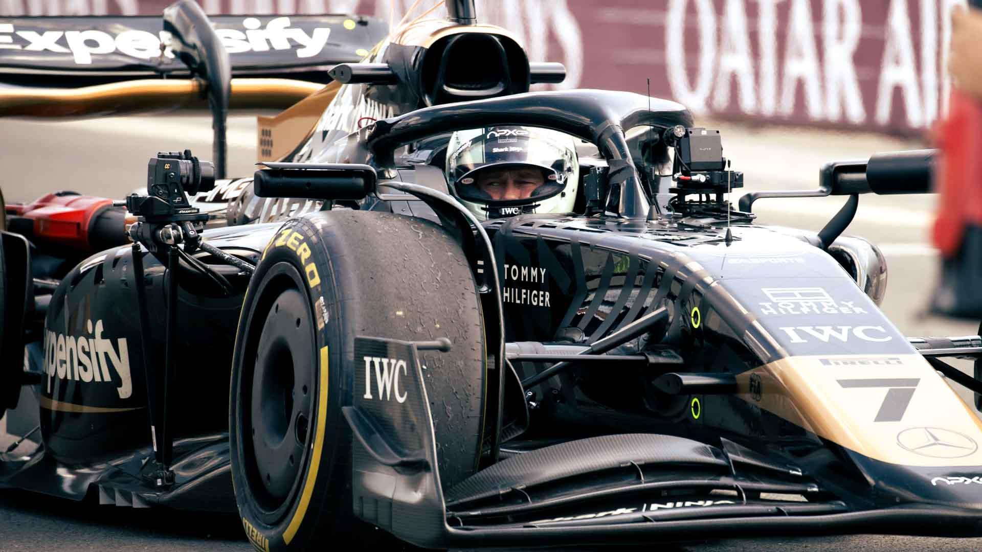 Brad Pitt inside a formula one racecar on the set of Formula One (2025).