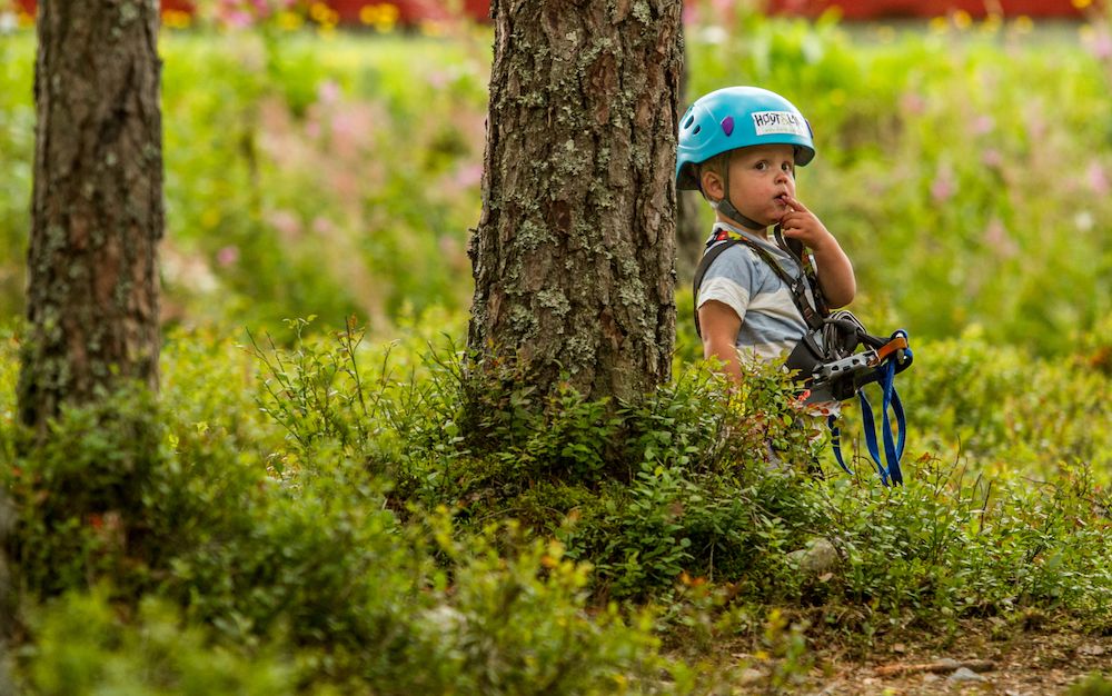little boy at the climbing park High and Low in Bø in Telemark 
