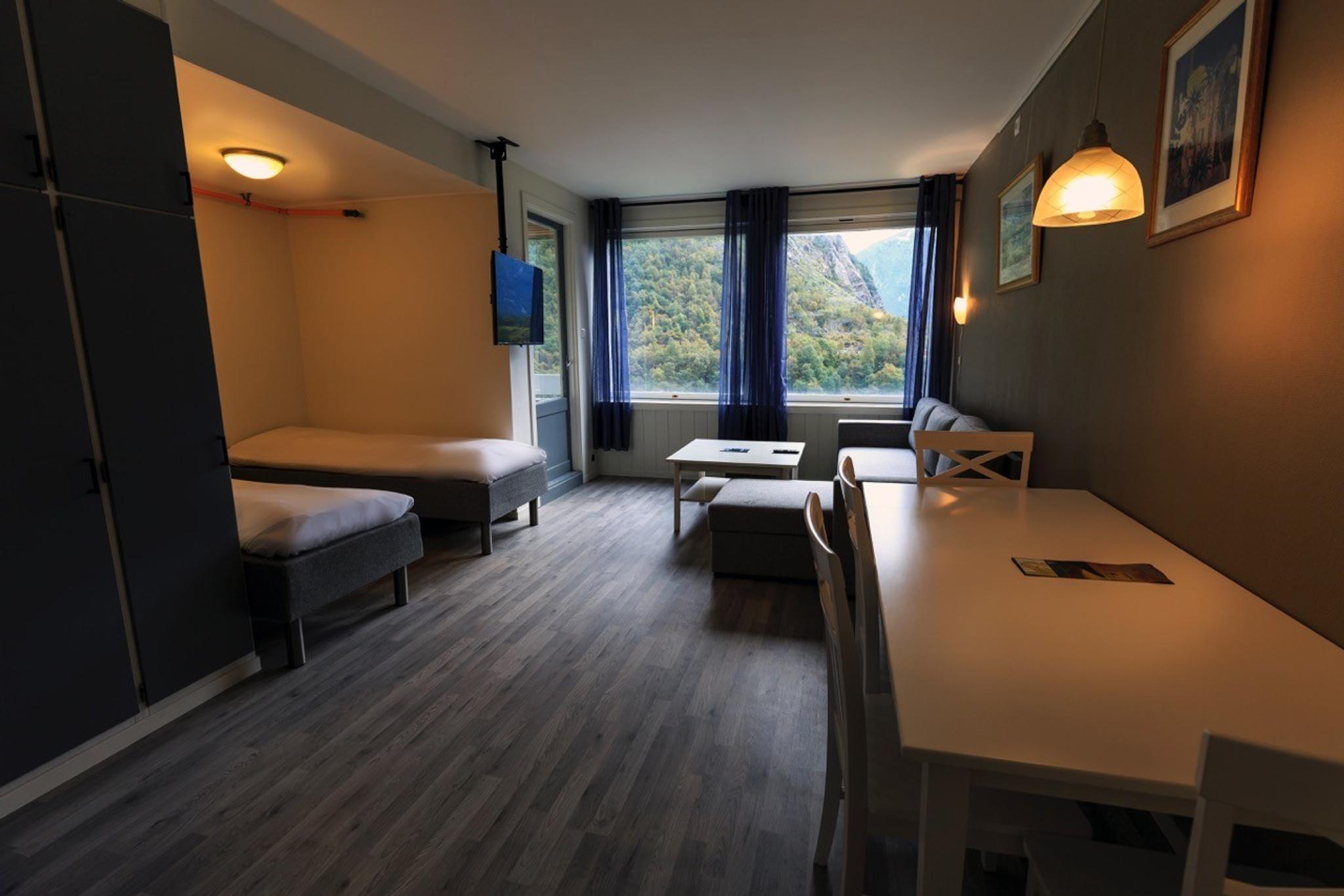 Bright and modern room at Trolltunga Guesthouse with mountain views in Hardanger.