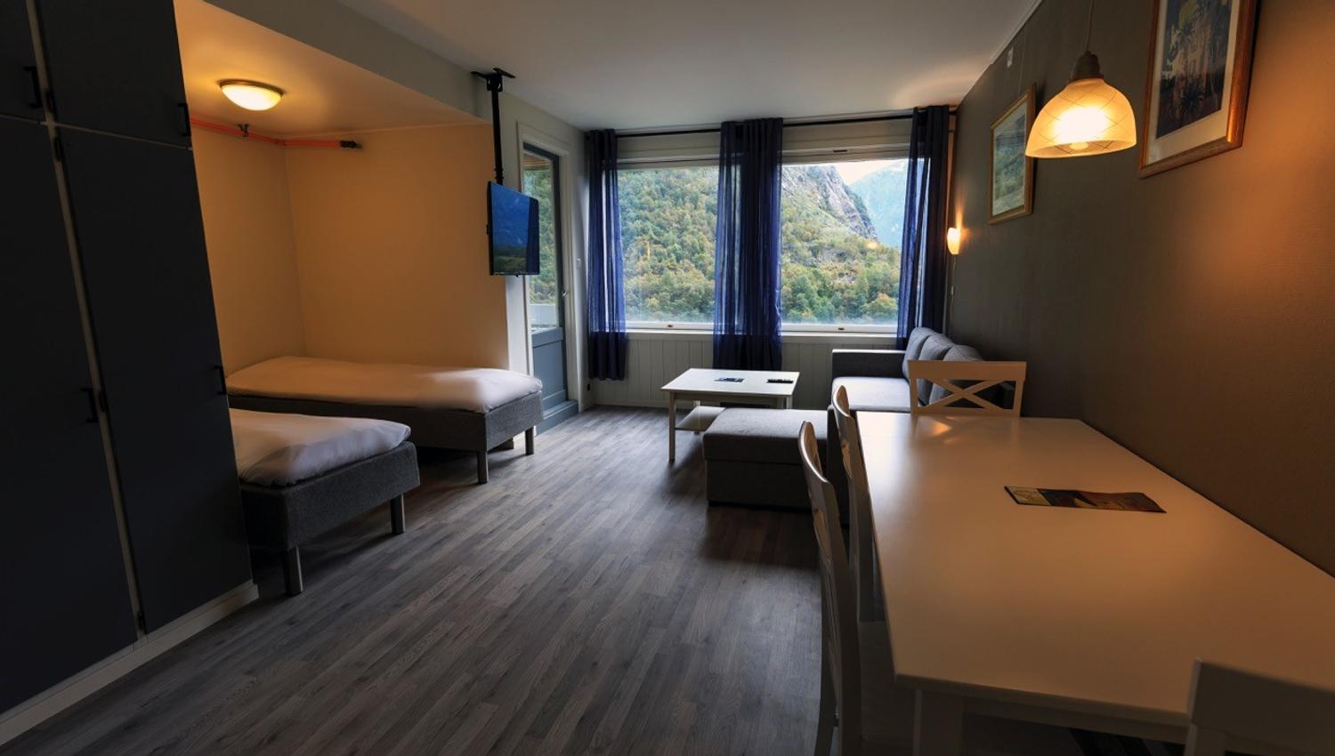 Bright and modern room at Trolltunga Guesthouse with mountain views in Hardanger.