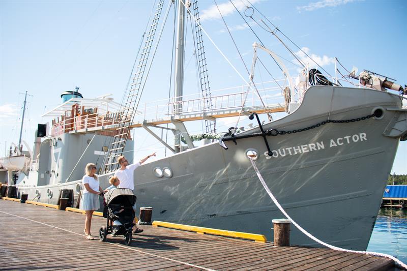 Family outside the whaleboat Southern Actor
