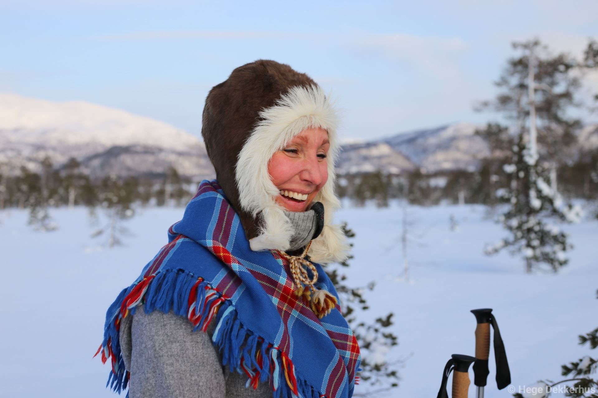 smiling woman outside in winter landscape