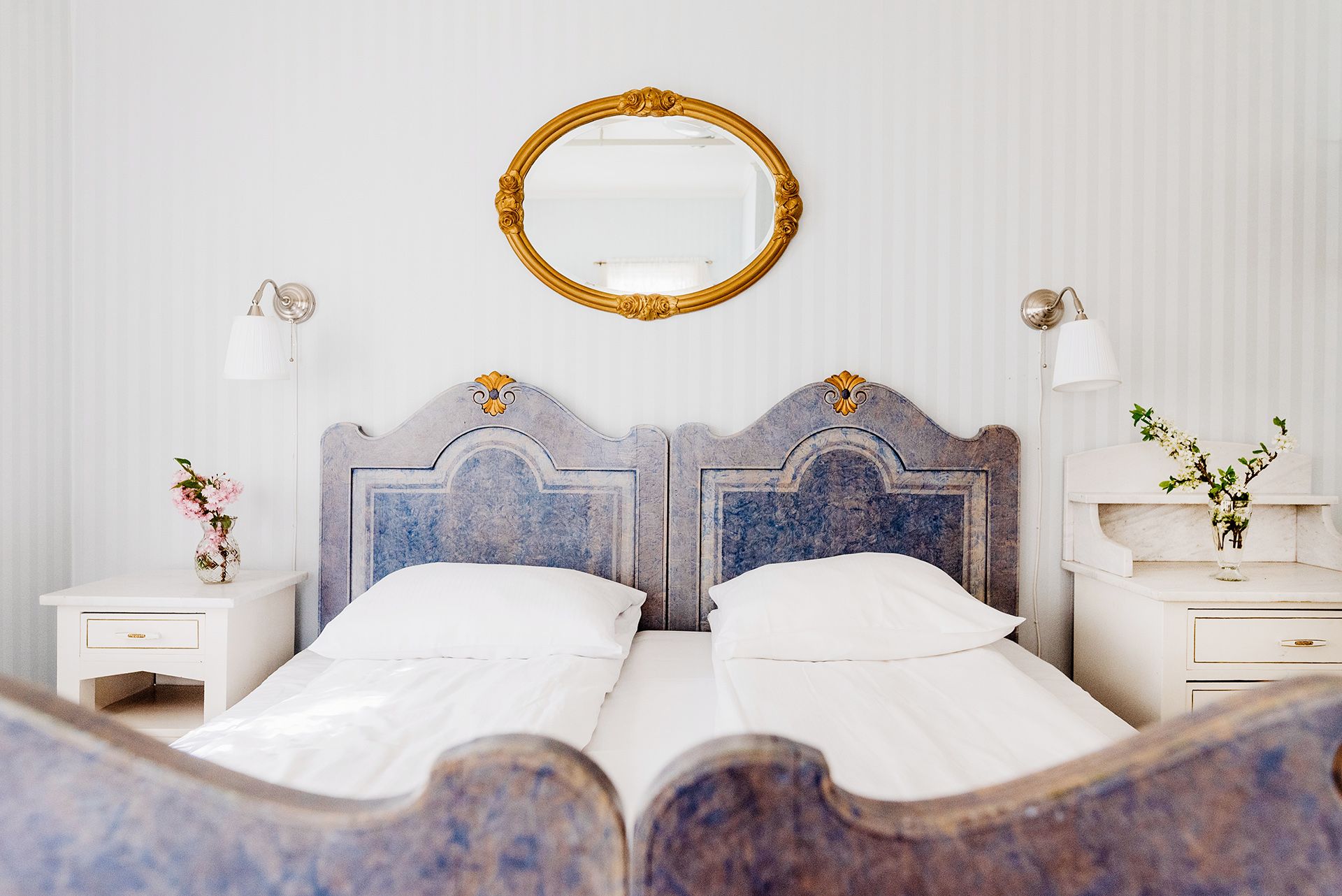 Unique double room with historic furniture and charming details at Utne Hotel.