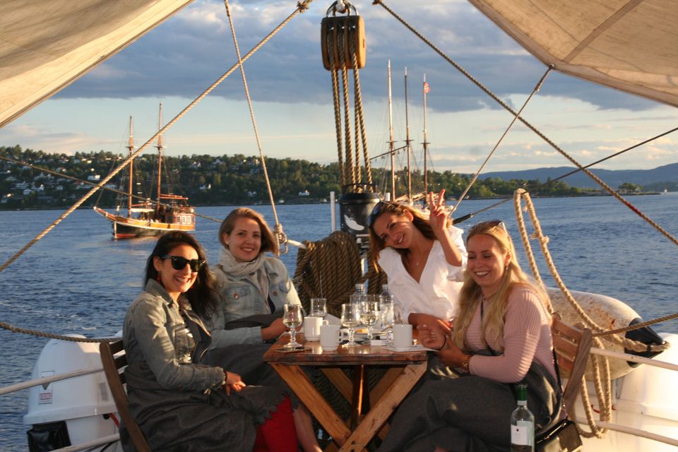 Four girls enjoying a drink on board.