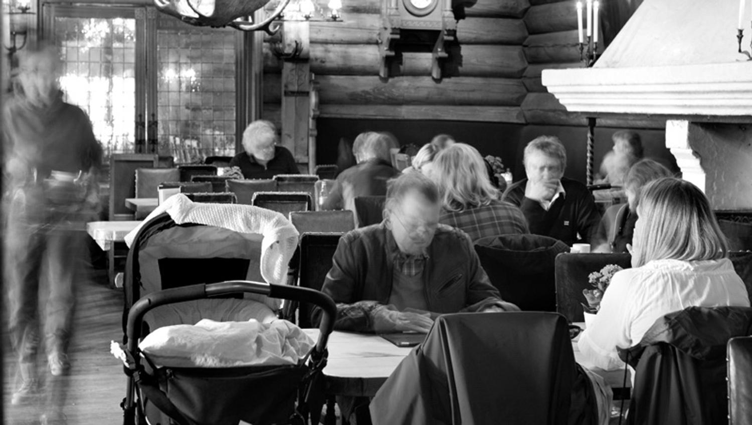 Black and white interior photo of the café.