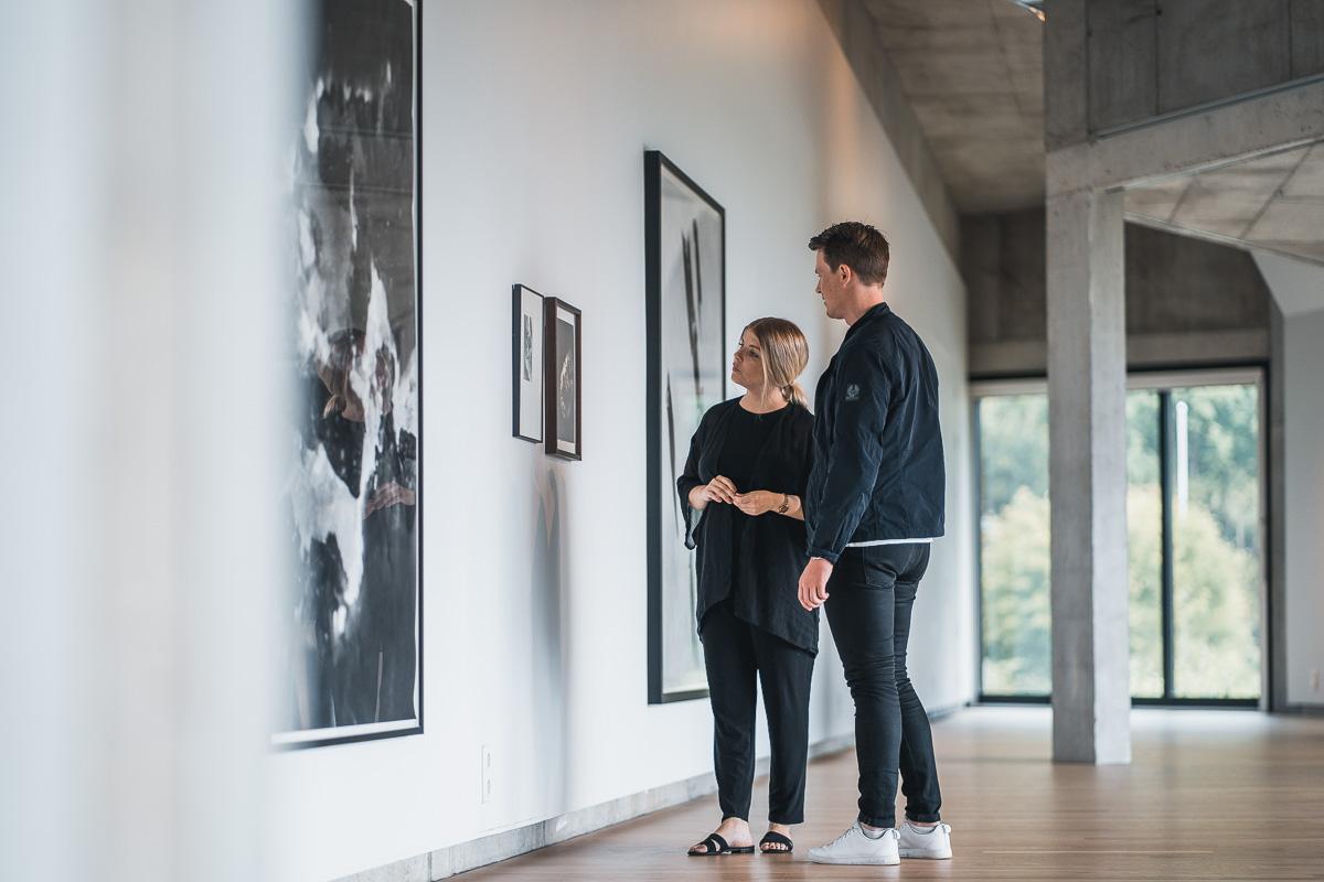 Visitors observing contemporary art on display at the Kabuso Art House.