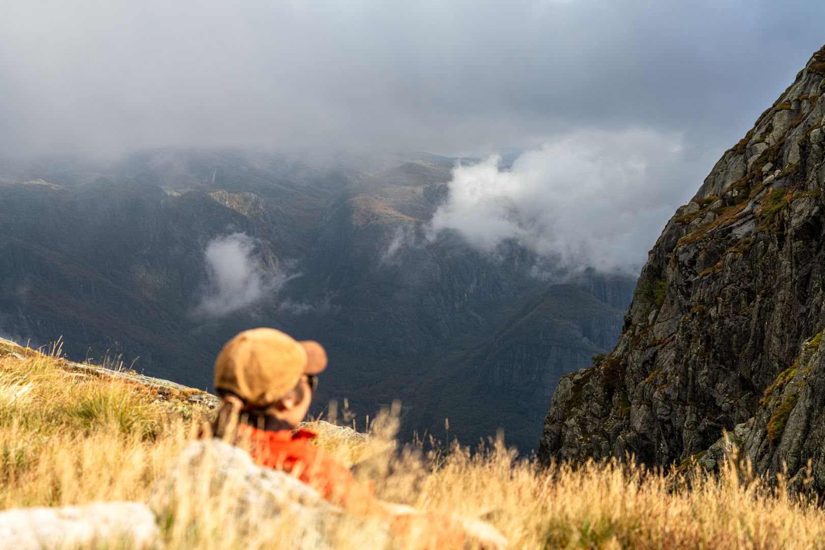 Hiker resting in the mountainous towards Kjerag