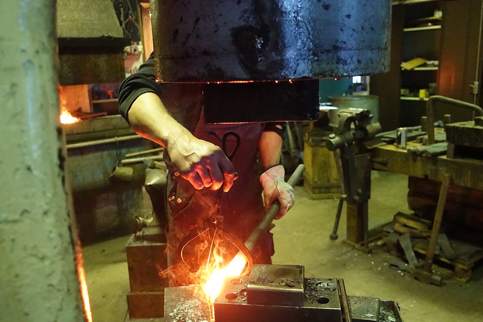 Blacksmithing at Hardanger Maritime Center with metal being heated in a forge.