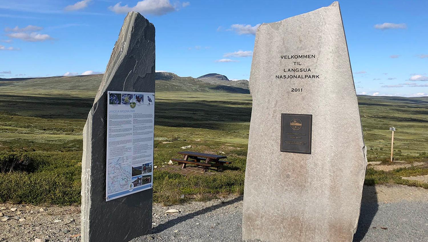 Information board on uprised slate plates at the trailhead to Skaget