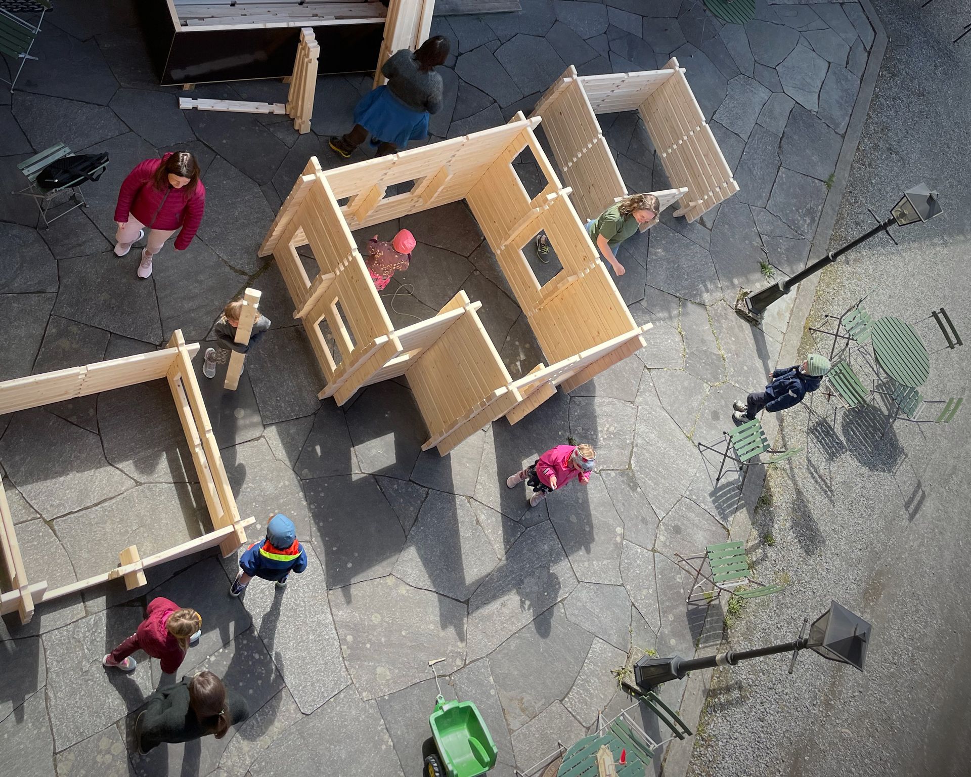 Children playing with wooden house building sets at Hardanger Maritime Center.