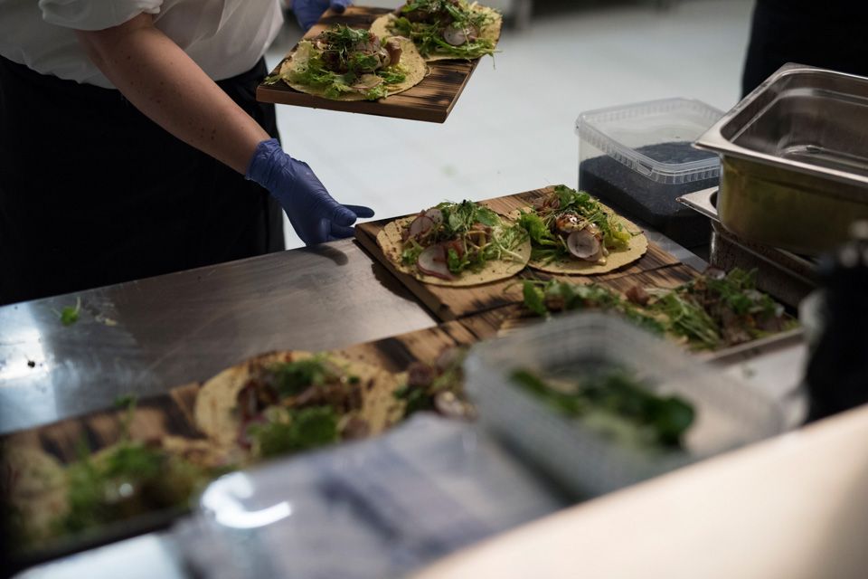 Detail photo of food being prepared by a chef.