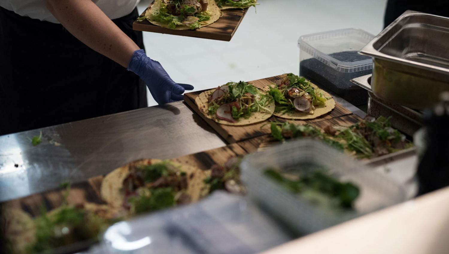 Detail photo of food being prepared by a chef.