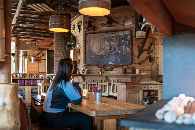 Girl stting at a table.