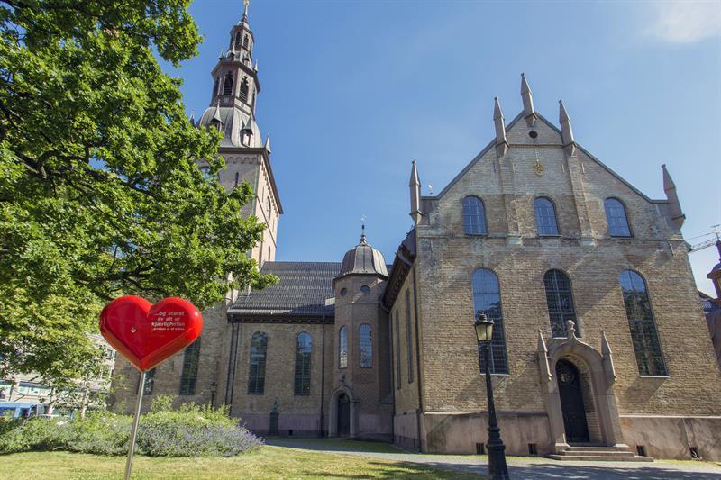 oslo cathedral with statue and tree in front