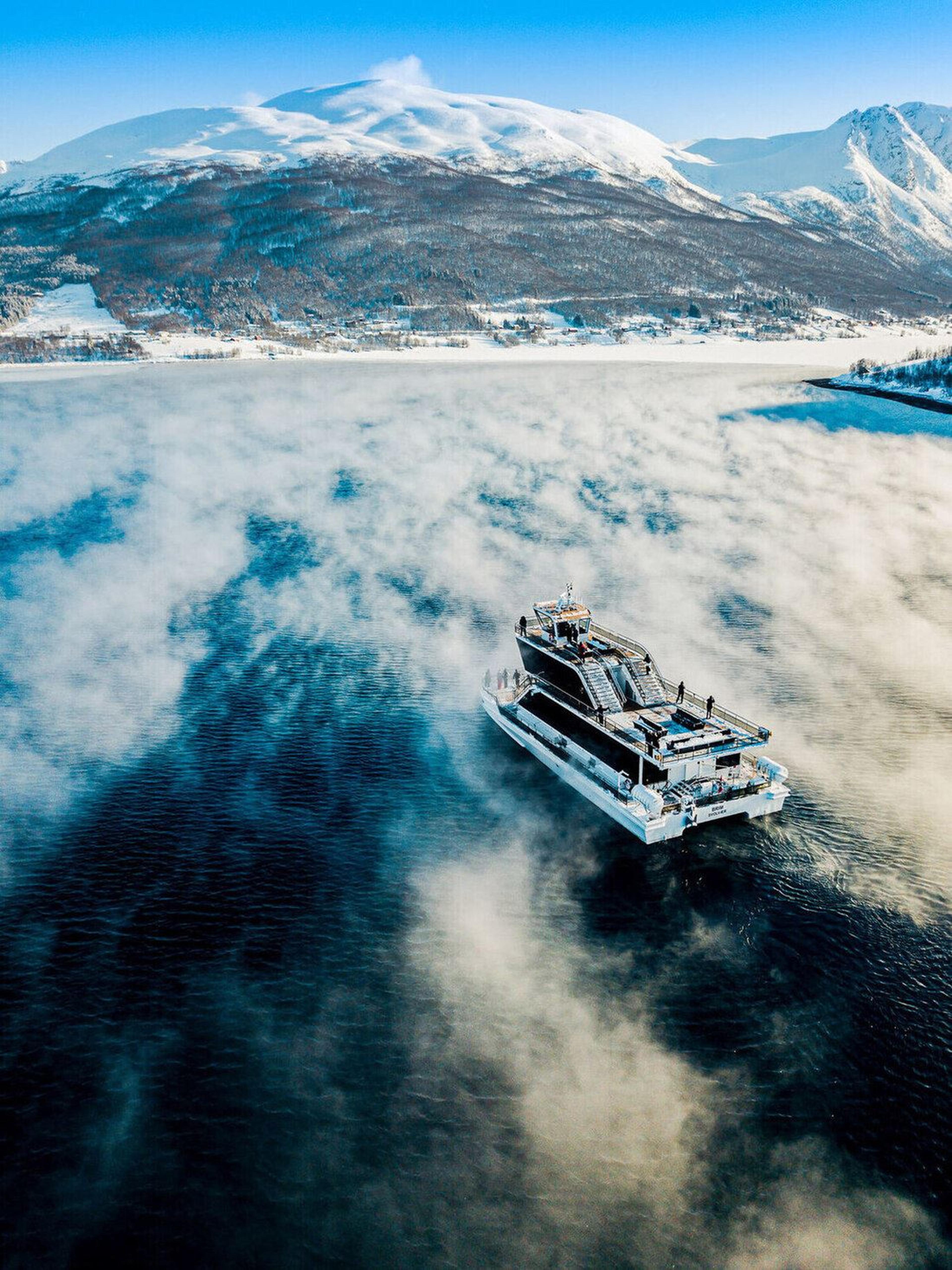 The boat surrounded by beautiful winter landscapes