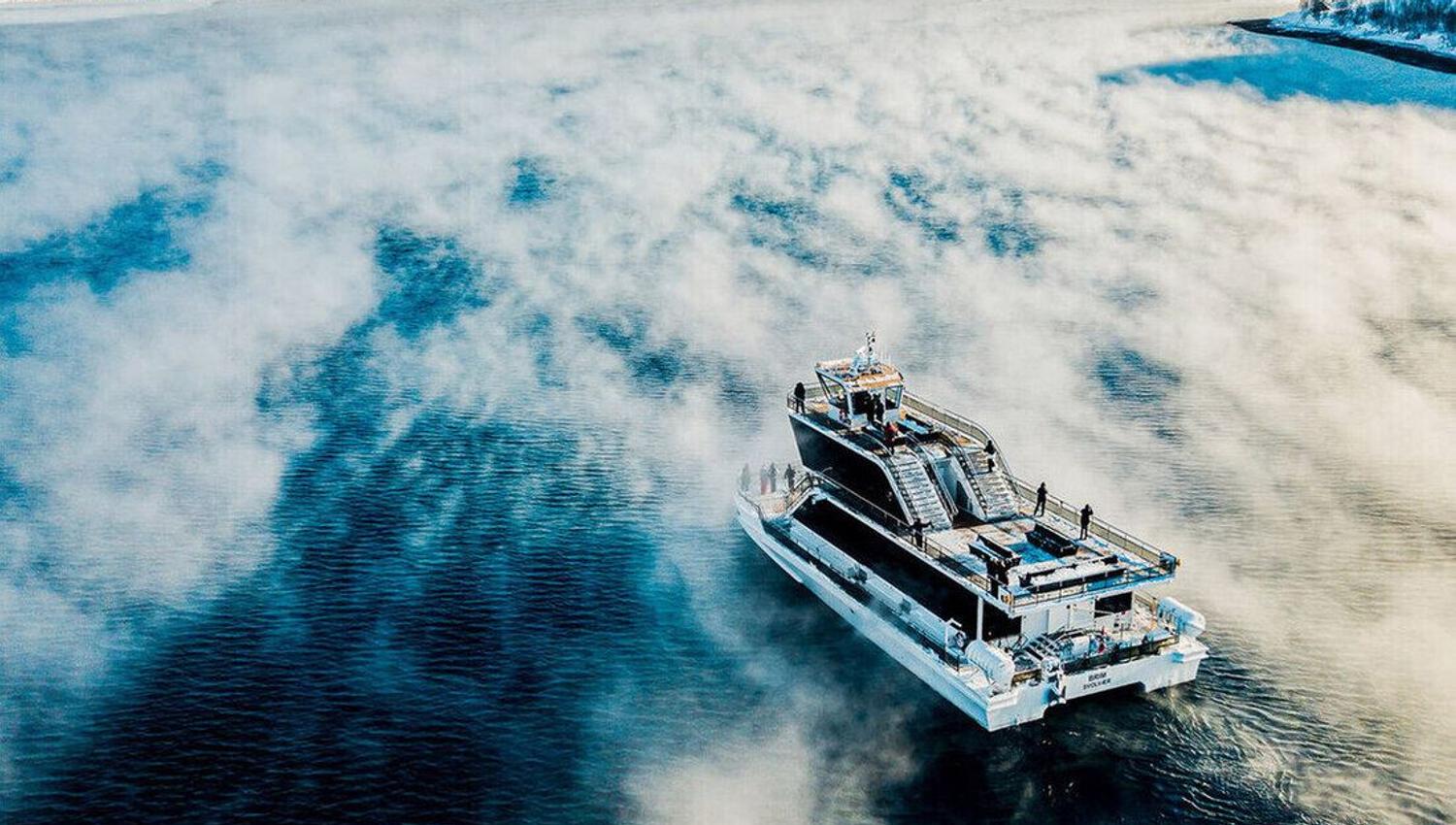 the boat surrounded by beautiful winter landscapes