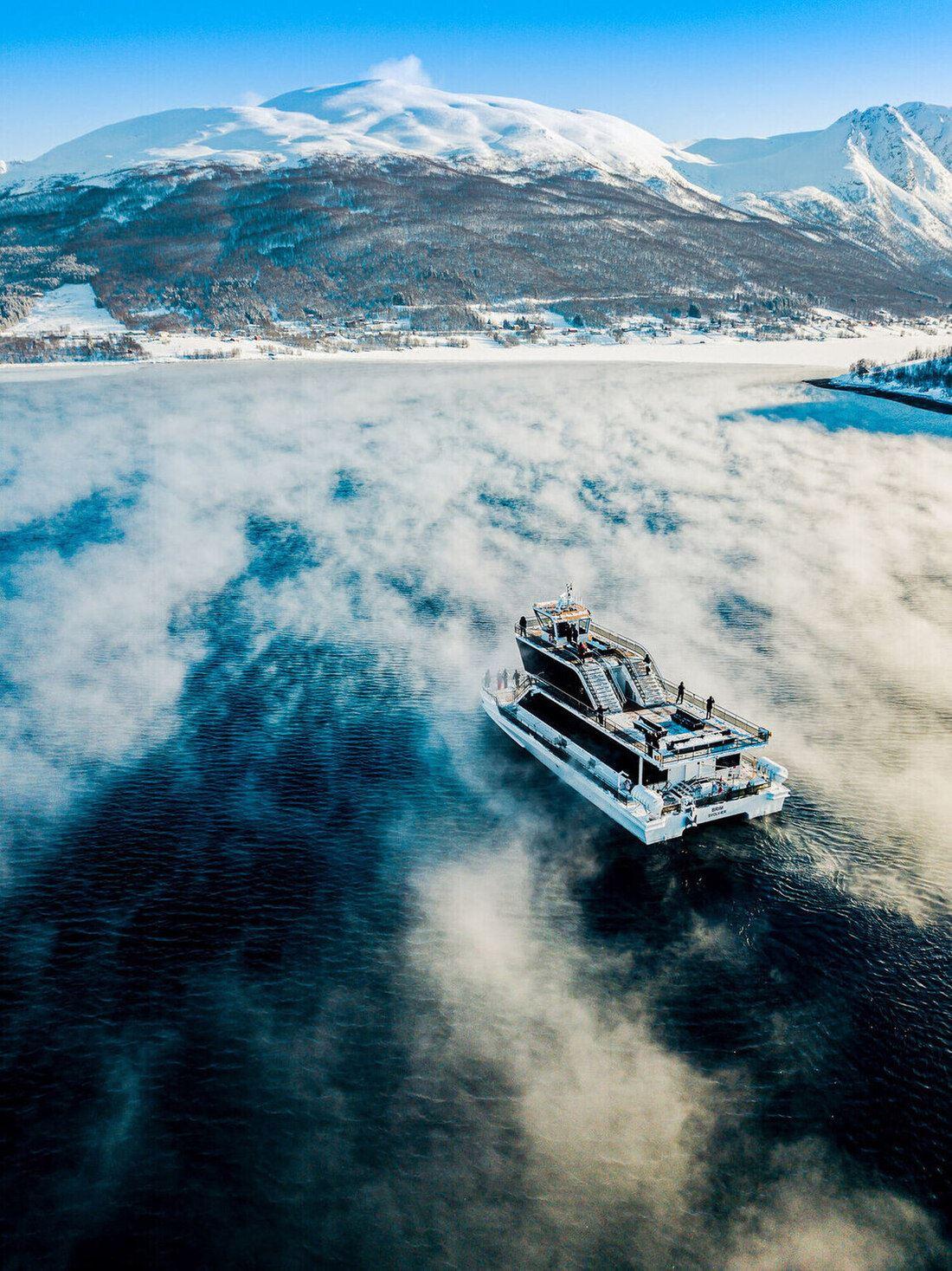 The boat surrounded by beautiful winter landscapes