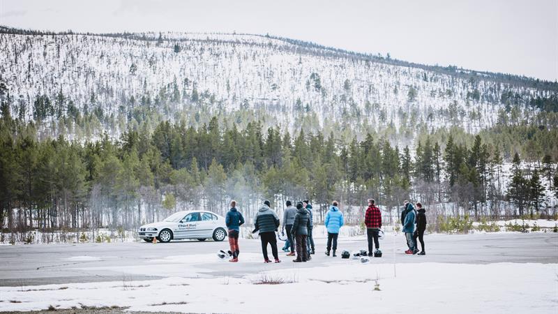 A group of spectators are eagerly following the rally.