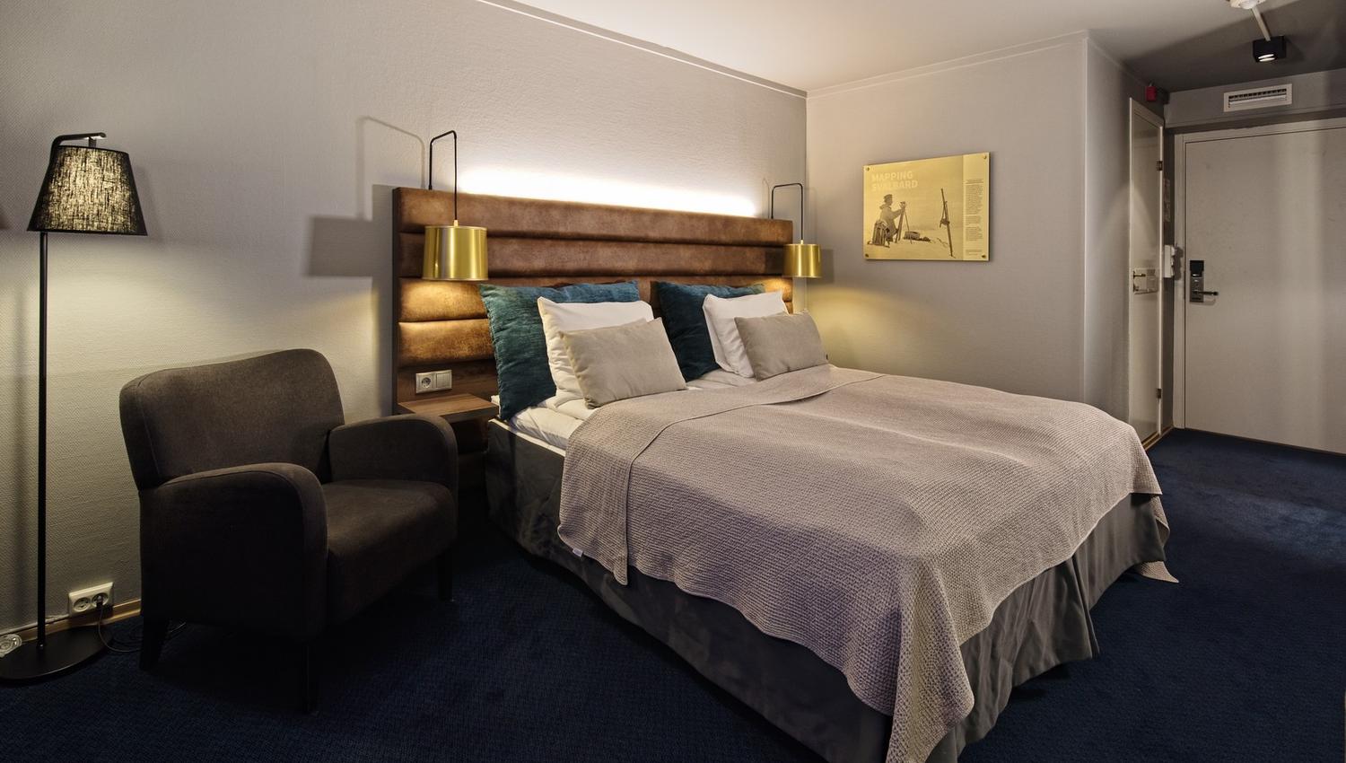 A bed in a hotel room