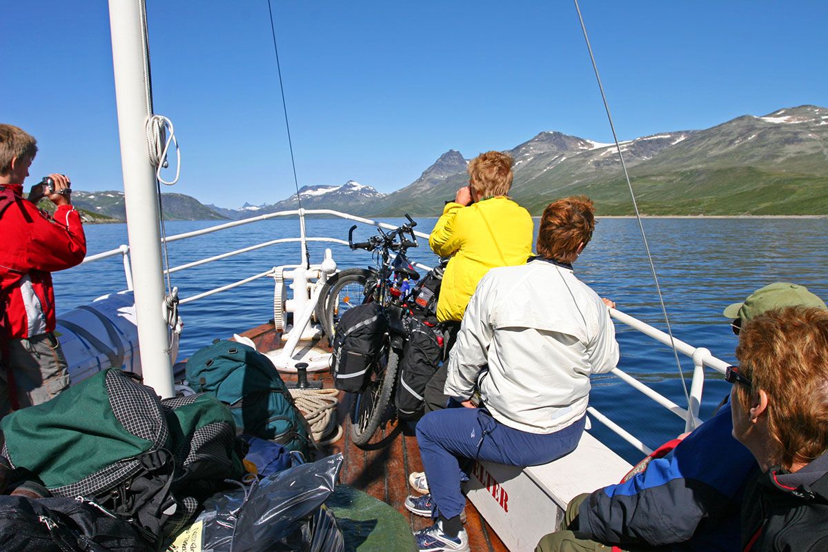 Sailing on M/B Bitihorn across Lake Bygdin, blue skies and 2000m-summits in the background