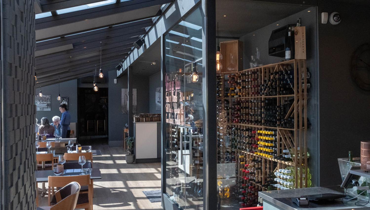 the restaurant with wine cabinet at Strøm mat & bar in Skien