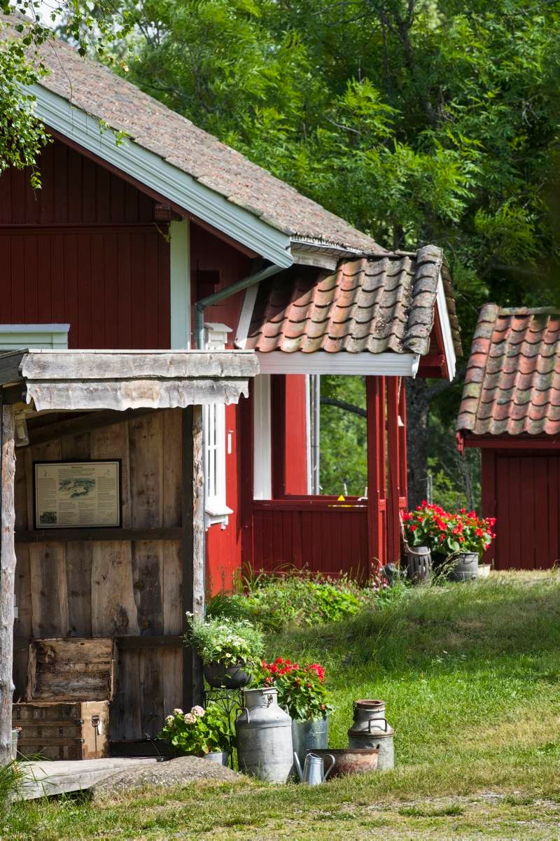 a small red farmhouse