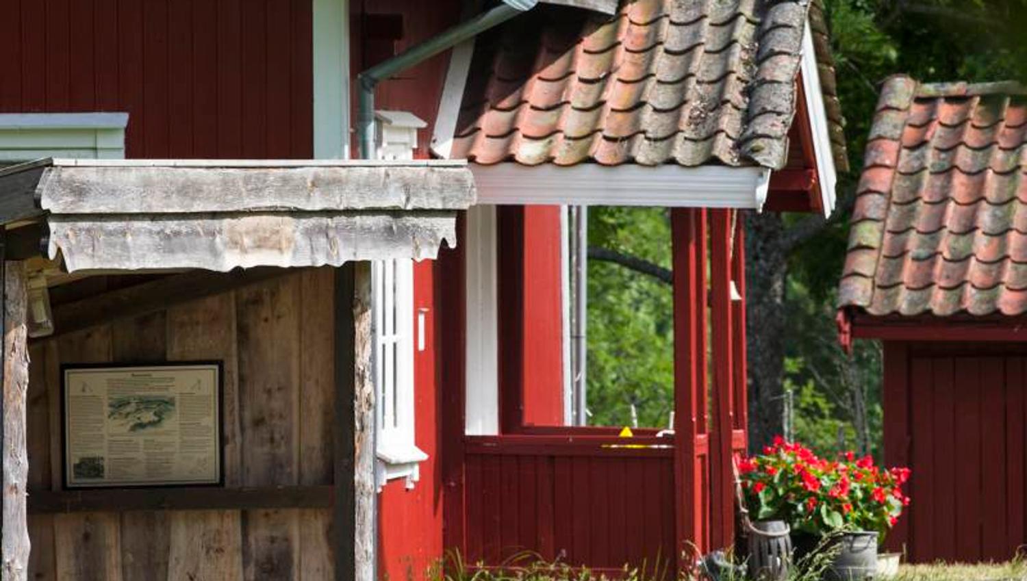 a small red farmhouse